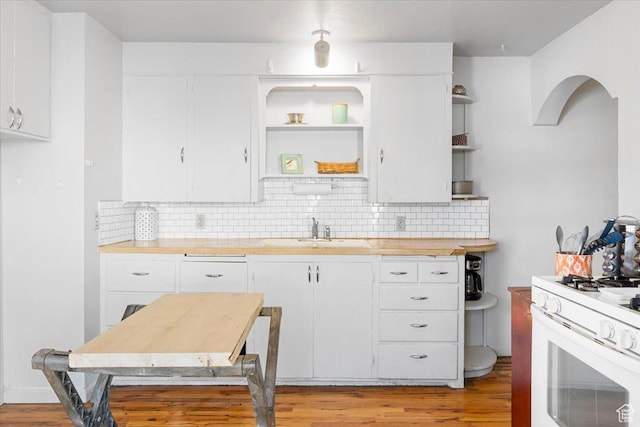 38 S State St W, Fairview, UT 84629 - kitchen featuring light hardwood / wood-style floors, white cabinetry, white gas range, and sink