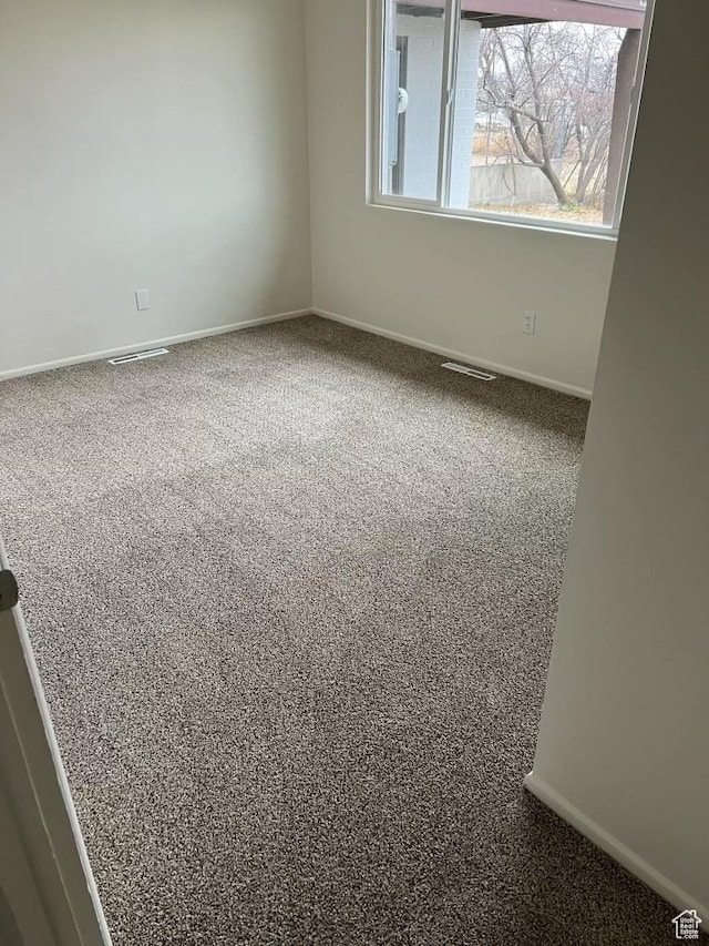220 S 100 E, Tooele, UT 84074 - unfurnished room featuring carpet floors and baseboards
