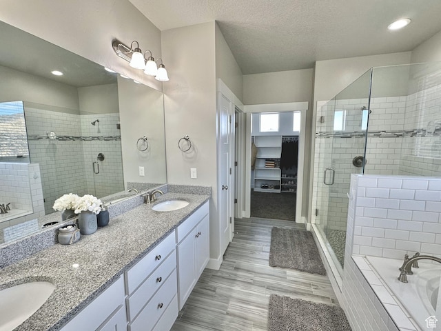 6057 W Herriman View Way S, Herriman, UT 84096 - full bathroom with a shower stall, a garden tub, and a sink