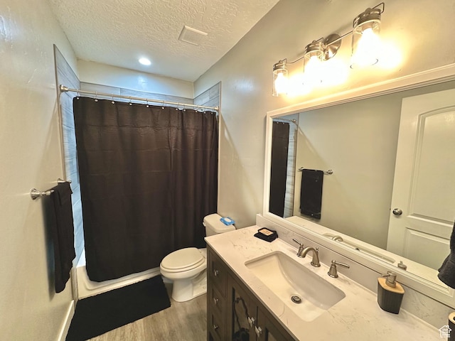 6057 W Herriman View Way S, Herriman, UT 84096 - full bathroom with wood finished floors, a textured ceiling, a shower with shower curtain, and toilet