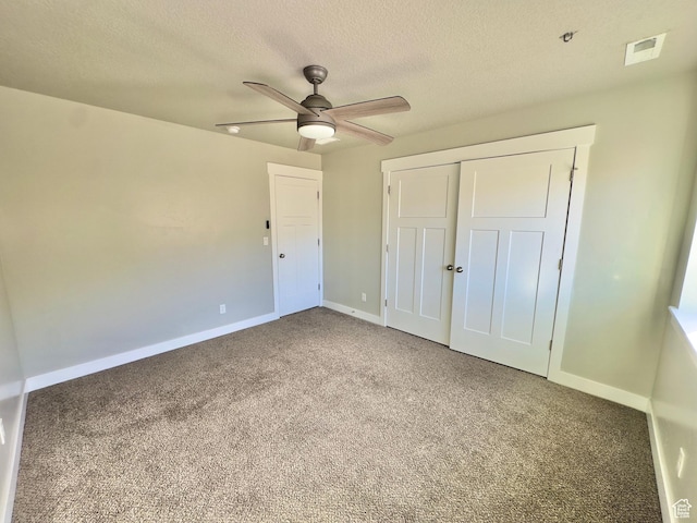 6057 W Herriman View Way S, Herriman, UT 84096 - unfurnished bedroom featuring a textured ceiling, a closet, baseboards, carpet flooring, and visible vents
