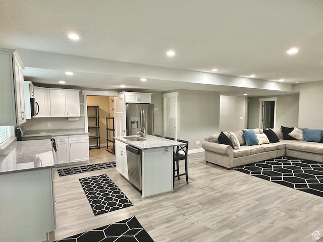 6057 W Herriman View Way S, Herriman, UT 84096 - kitchen featuring open floor plan, light wood-style floors, stainless steel appliances, white cabinetry, and recessed lighting