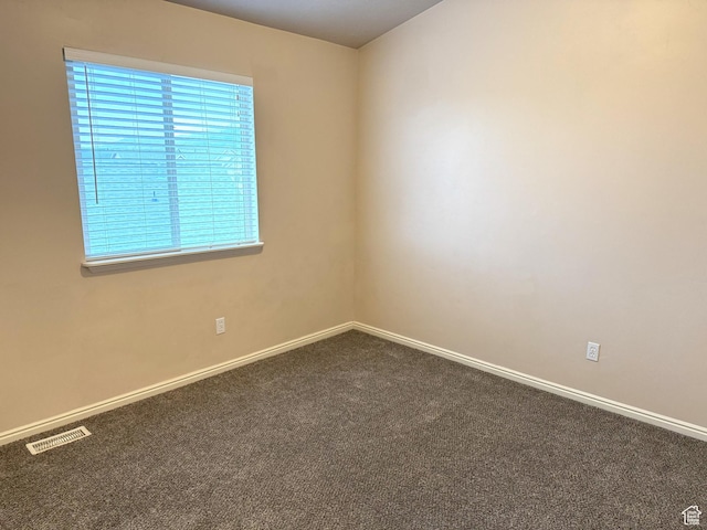 empty room featuring carpet flooring