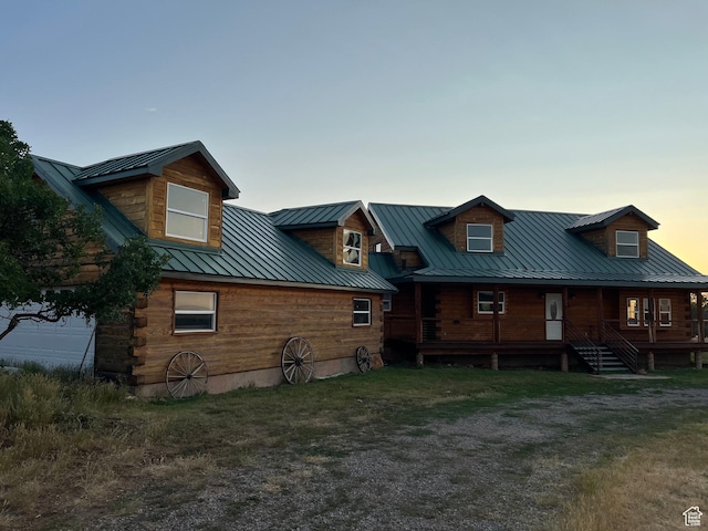 back house at dusk with a garage