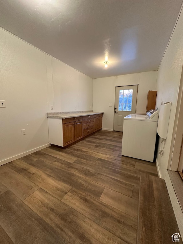 washroom featuring cabinets, washer / dryer, and dark hardwood / wood-style flooring