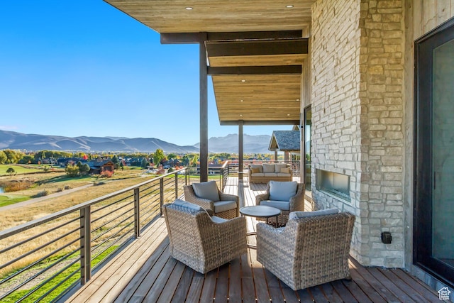 2072 E Copper Belt Dr, Heber City, UT 84032 - deck with an outdoor living space with a fireplace and a mountain view