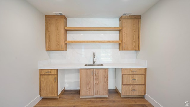 2072 E Copper Belt Dr, Heber City, UT 84032 - kitchen featuring backsplash, sink, and light hardwood / wood-style flooring