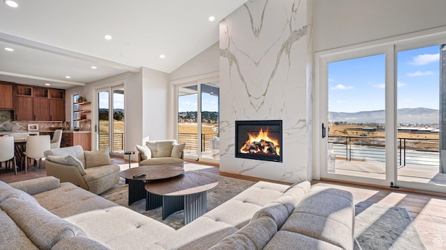 2072 E Copper Belt Dr, Heber City, UT 84032 - living room with a mountain view, wood-type flooring, lofted ceiling, and a fireplace