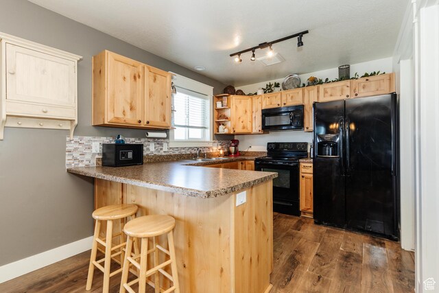 2814 S 1150 W, Nibley, UT 84321 - kitchen featuring dark wood finished floors, light brown cabinets, open shelves, black appliances, and a peninsula