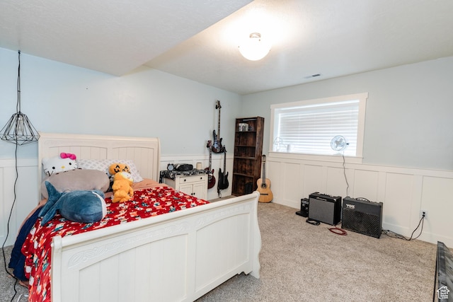 2814 S 1150 W, Nibley, UT 84321 - bedroom with visible vents, a wainscoted wall, and light carpet