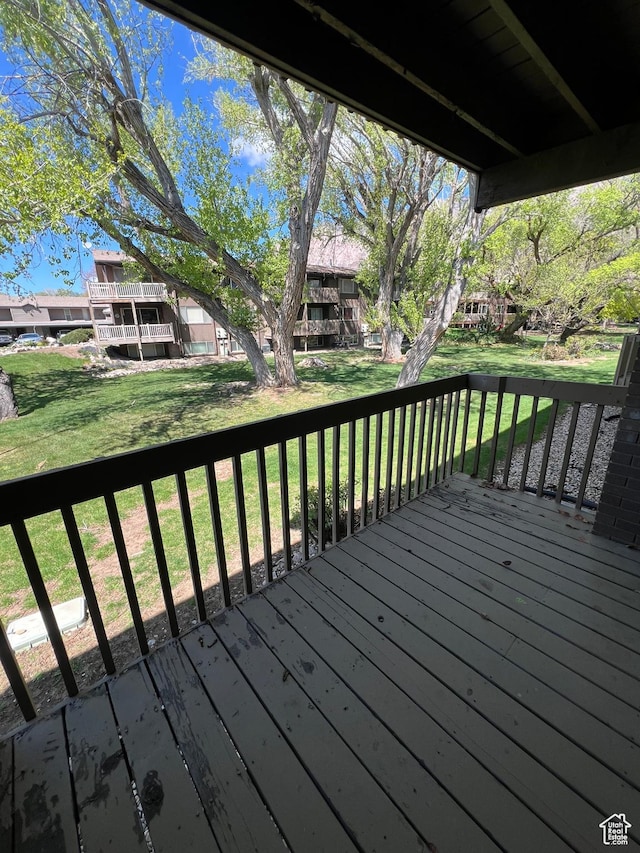 wooden deck with a yard