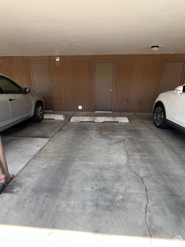 parking garage featuring wood walls