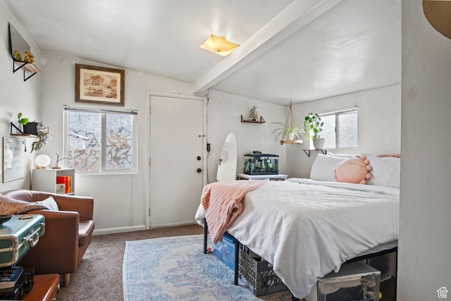 carpeted bedroom featuring lofted ceiling with beams