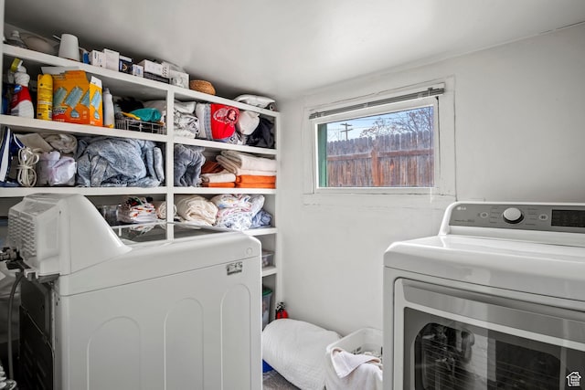 washroom with independent washer and dryer