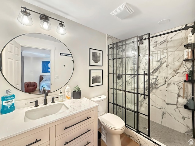 bathroom with connected bathroom, toilet, visible vents, vanity, and a marble finish shower