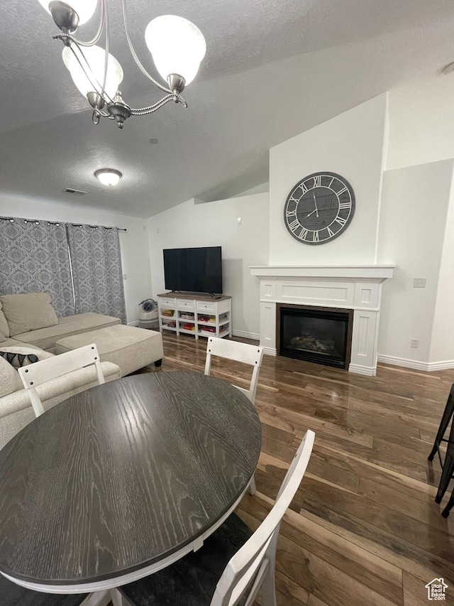 1715 W Westbury Way Unit Z12, Lehi, UT 84043 - living room with a chandelier, a textured ceiling, dark hardwood / wood-style flooring, and lofted ceiling