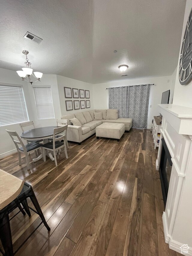 1715 W Westbury Way Unit Z12, Lehi, UT 84043 - living room with dark hardwood / wood-style flooring, a textured ceiling, and a chandelier