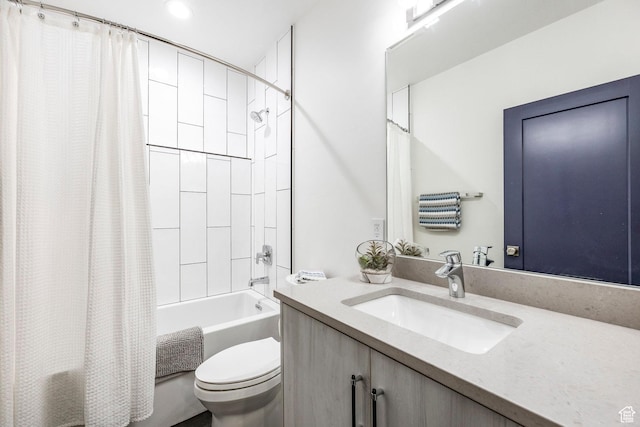 full bathroom featuring shower / bath combination with curtain, vanity, and toilet