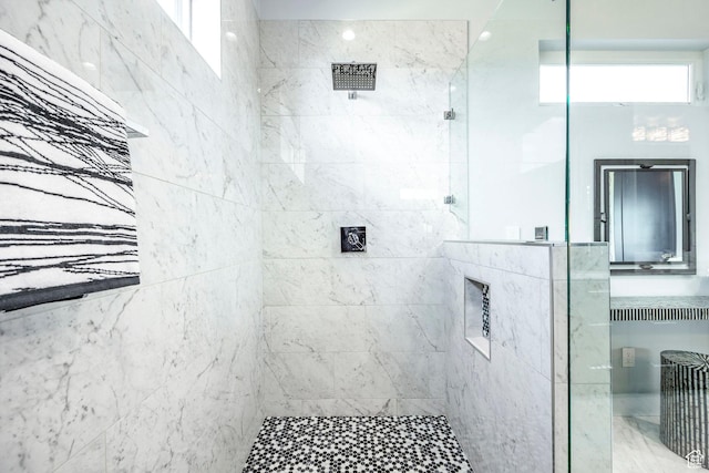 bathroom with a tile shower