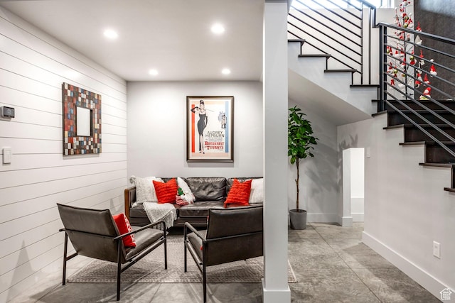 living room featuring wooden walls