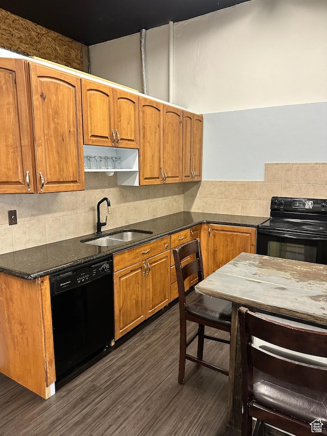 45 W Main St, Moroni, UT 84646 - kitchen featuring black appliances, dark hardwood / wood-style floors, backsplash, and sink