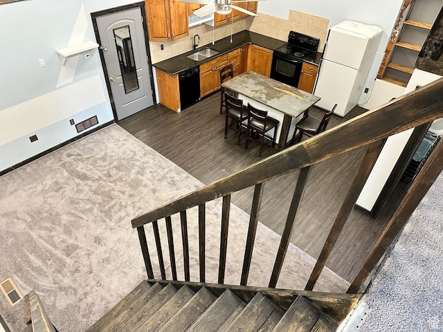 45 W Main St, Moroni, UT 84646 - kitchen featuring black appliances, sink, ceiling fan, dark hardwood / wood-style floors, and tasteful backsplash