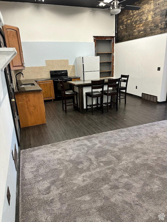 45 W Main St, Moroni, UT 84646 - dining space featuring dark hardwood / wood-style floors, ceiling fan, and sink