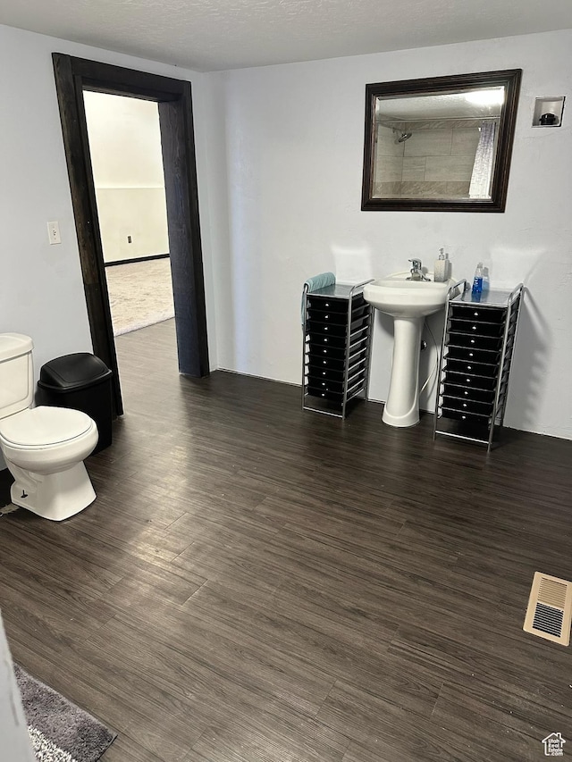 45 W Main St, Moroni, UT 84646 - bathroom with hardwood / wood-style floors, toilet, and sink