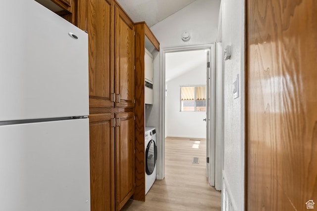 1160 E Telegraph St Unit 4, Washington, UT 84780 - laundry area with washer / clothes dryer and light hardwood / wood-style flooring