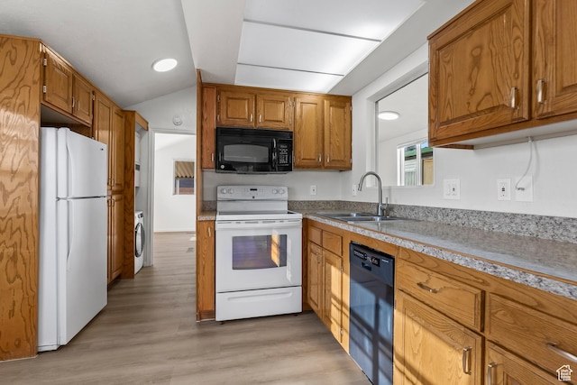1160 E Telegraph St Unit 4, Washington, UT 84780 - kitchen with light wood-type flooring, sink, black appliances, washer / clothes dryer, and lofted ceiling