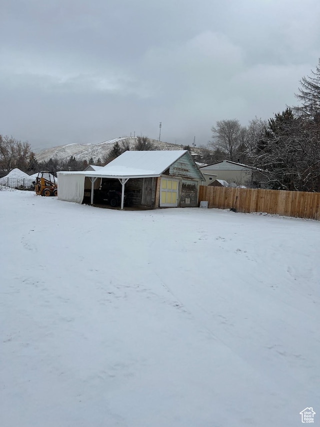 340 Jefferson St, Montpelier, ID 83254 - yard covered in snow with fence and an outdoor structure