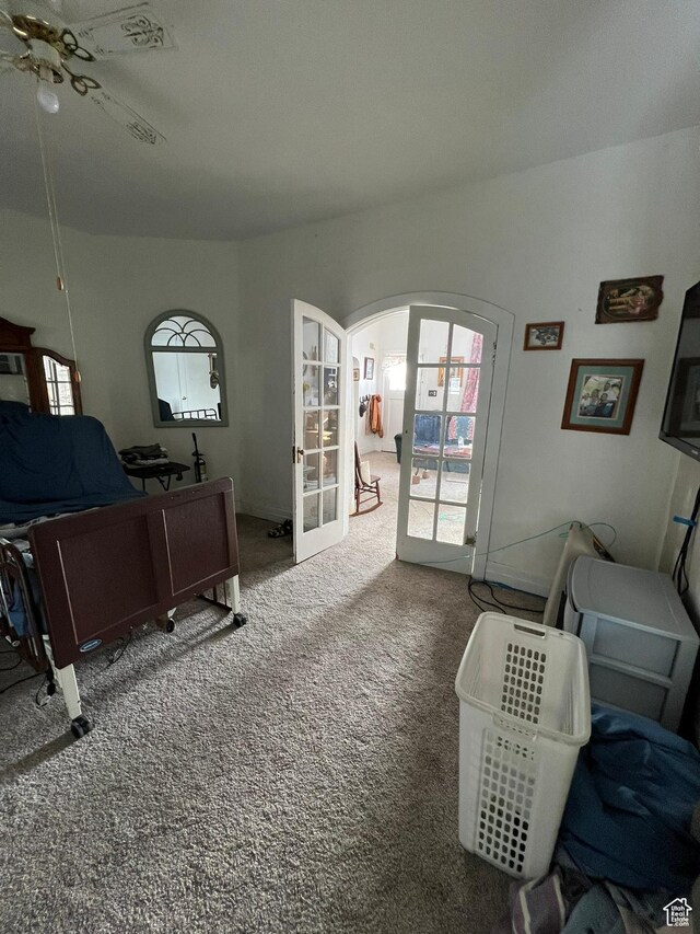 340 Jefferson St, Montpelier, ID 83254 - carpeted living area with arched walkways and french doors