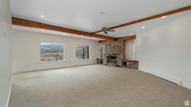 unfurnished living room featuring a stone fireplace, light carpet, beamed ceiling, and a baseboard heating unit