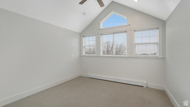 empty room with ceiling fan, light colored carpet, lofted ceiling, and a baseboard heating unit