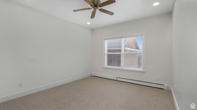 carpeted spare room with baseboard heating and ceiling fan