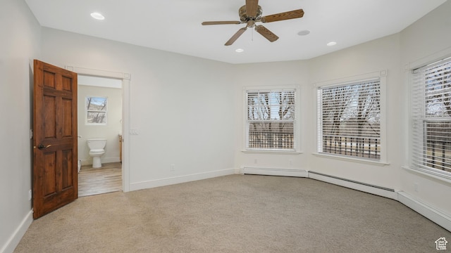 unfurnished bedroom featuring light carpet, ensuite bathroom, and ceiling fan