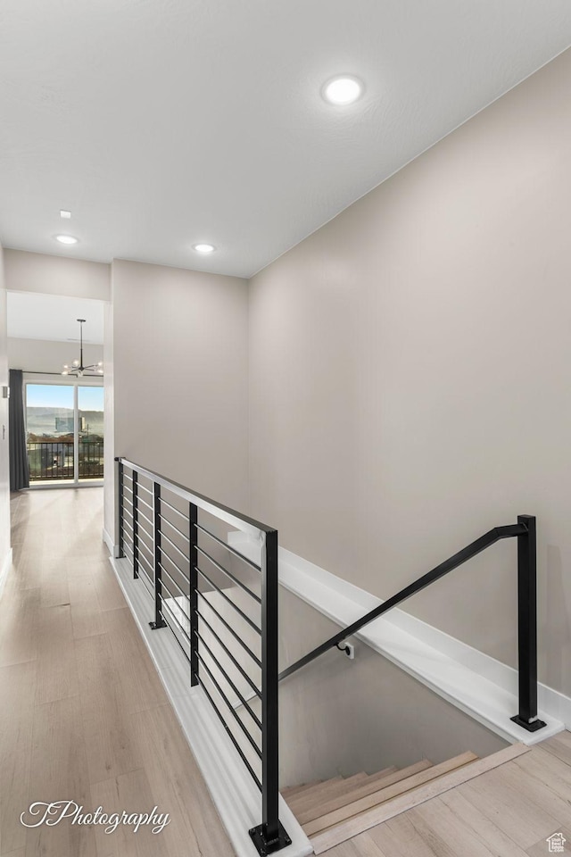 interior space featuring hardwood / wood-style flooring and a notable chandelier