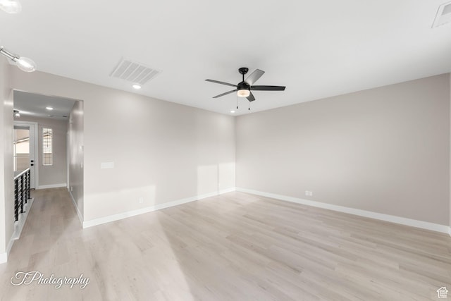 unfurnished room with ceiling fan and light hardwood / wood-style flooring