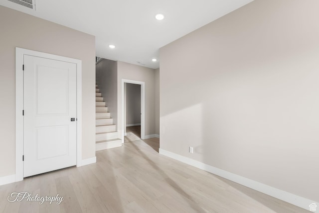 unfurnished room featuring light wood-type flooring