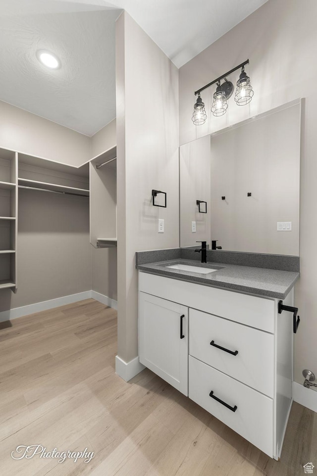 bathroom featuring vanity and hardwood / wood-style flooring