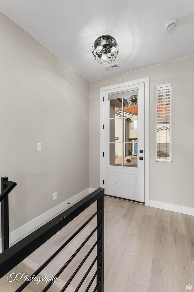 hall featuring light wood-type flooring