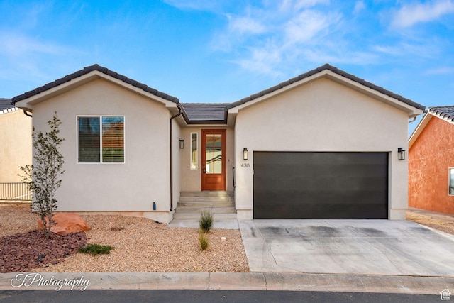 ranch-style home with a garage