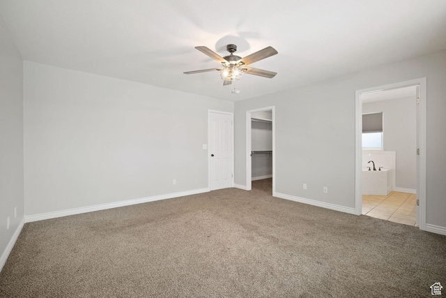 6190 W 5950 S, Hooper, UT 84315 - unfurnished bedroom with light carpet, a walk in closet, ceiling fan, connected bathroom, and a closet