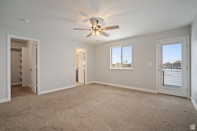 6190 W 5950 S, Hooper, UT 84315 - unfurnished bedroom with light carpet, ensuite bathroom, ceiling fan, a spacious closet, and a closet