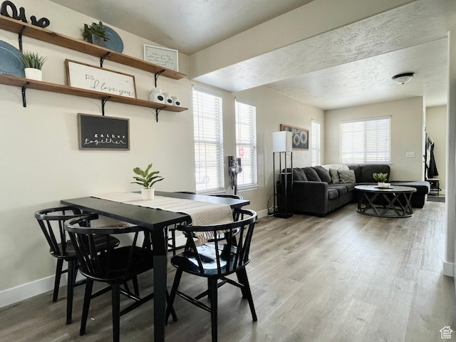 908 W Timpie Rd S, Tooele, UT 84074 - dining space with baseboards and light wood-style floors