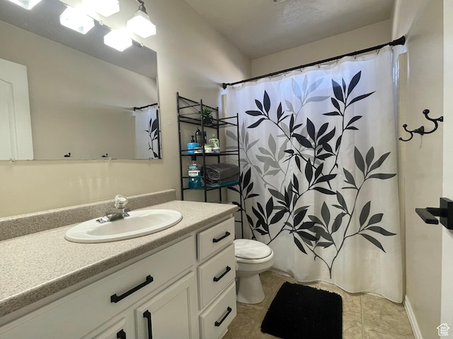 908 W Timpie Rd S, Tooele, UT 84074 - full bathroom featuring vanity, toilet, tile patterned floors, and curtained shower
