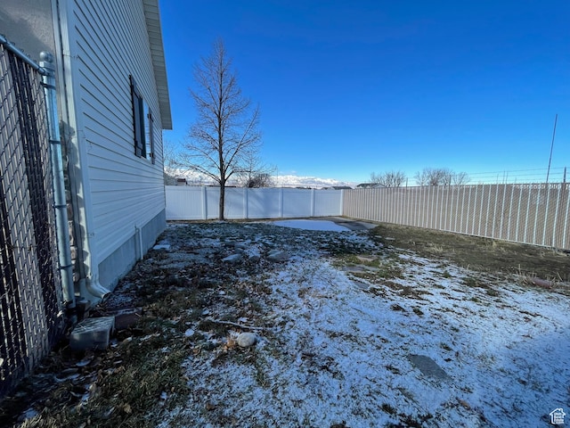 908 W Timpie Rd S, Tooele, UT 84074 - yard covered in snow with a fenced backyard