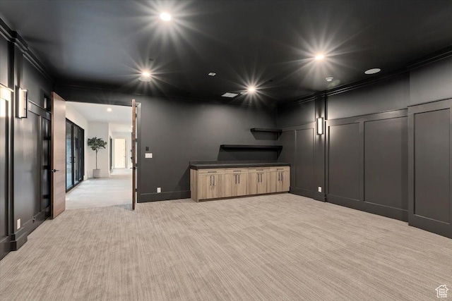 1316 N Gold Mountain Cir, Heber City, UT 84032 - unfurnished living room featuring light carpet, a decorative wall, and recessed lighting