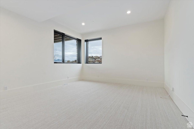 1316 N Gold Mountain Cir, Heber City, UT 84032 - spare room with light carpet and recessed lighting