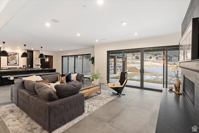 1316 N Gold Mountain Cir, Heber City, UT 84032 - living area featuring recessed lighting, french doors, a fireplace, and baseboards